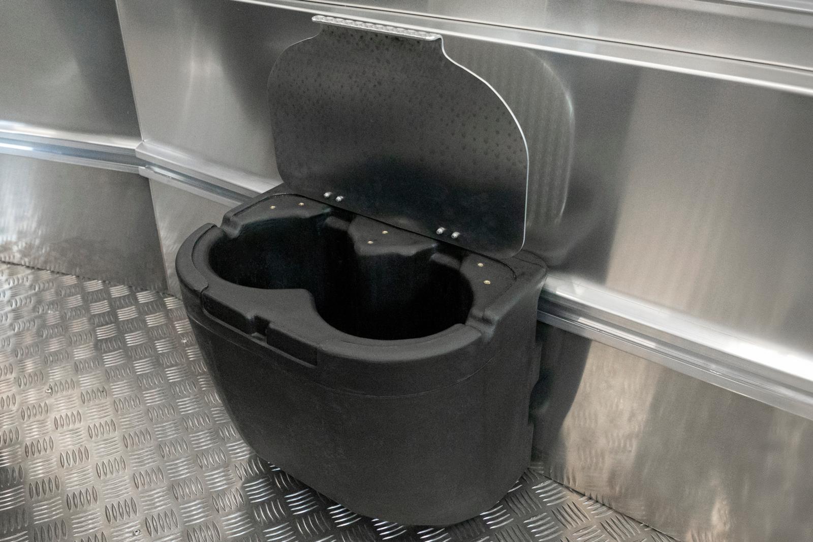 Storage for mooring lines, including aluminum lid. Doubles as a tread.