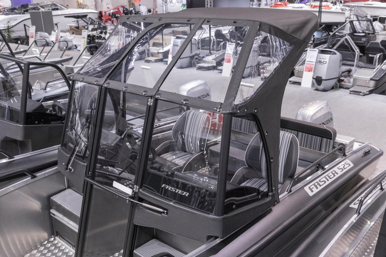 Sheltering Sprayhood cover over the consoles and driver/co-driver seats.